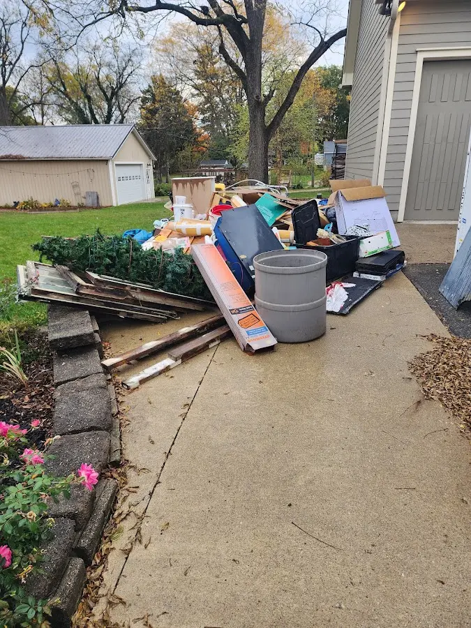 Dumpster being loaded with debris for Commercial Dumpster Rental in Midlothian